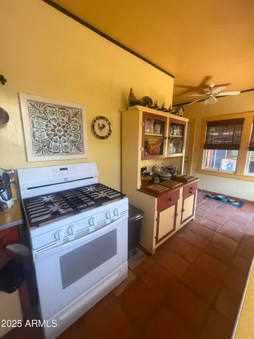 a kitchen with stainless steel appliances granite countertop a stove and a microwave