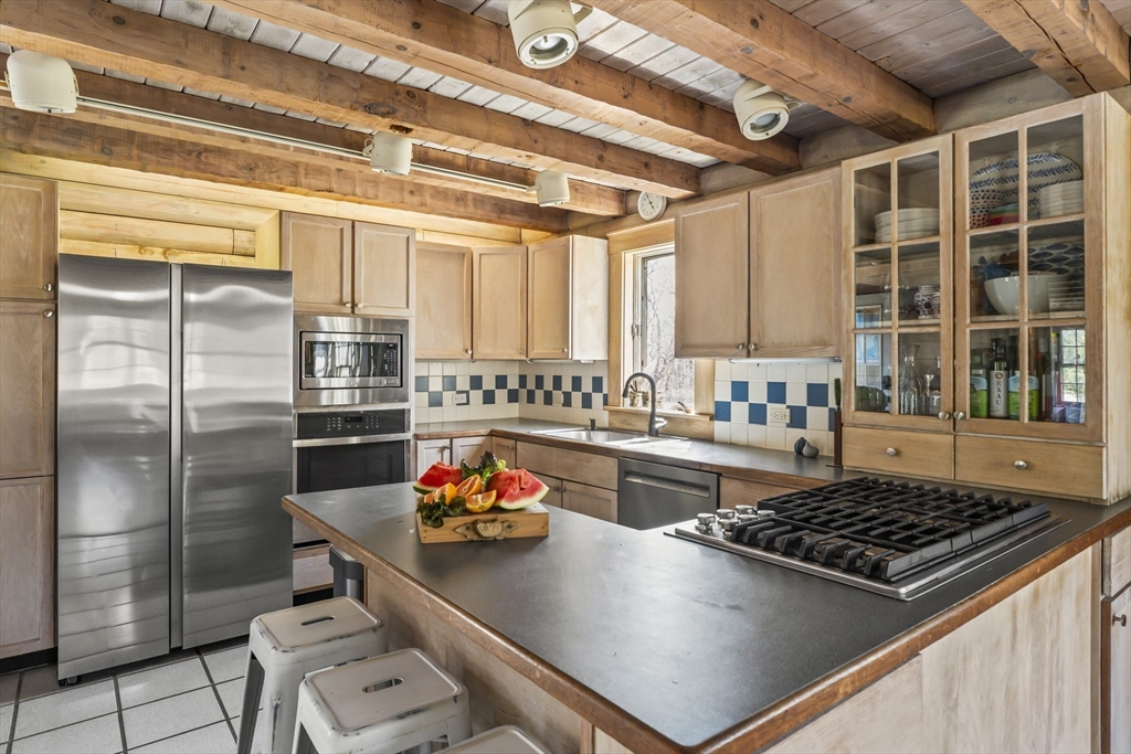 7 Pip'n Road Edgartown, MA 02539 - Photo 4 of 41 a kitchen with a stove a refrigerator and a sink