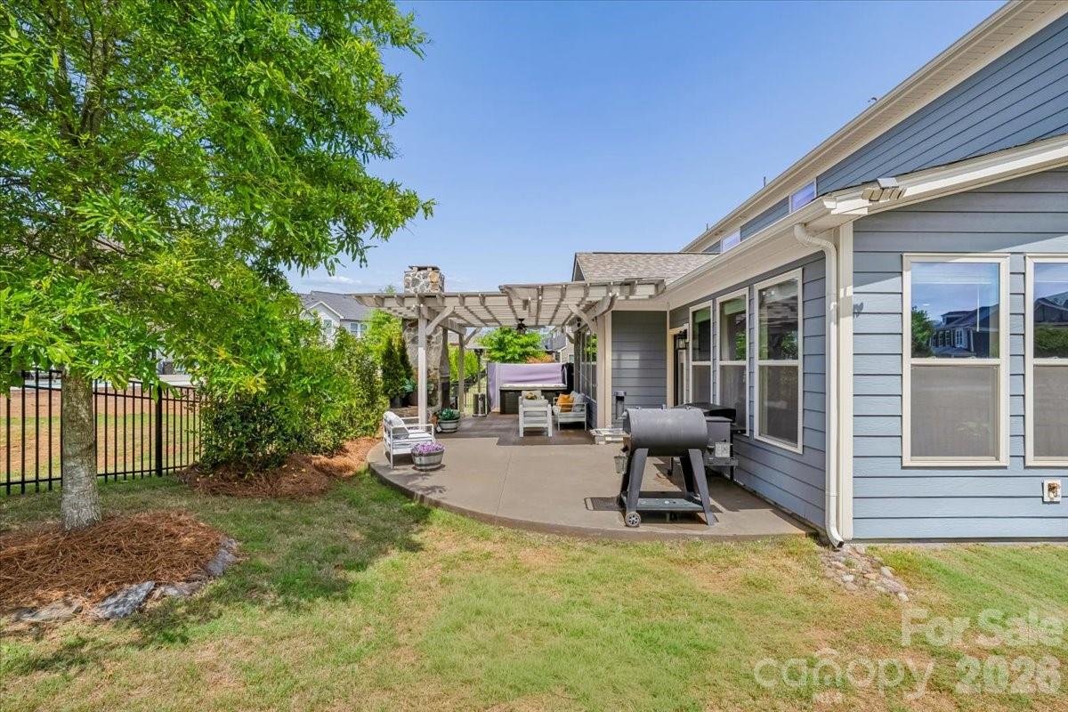 1135 Weir Court Fort Mill, SC 29708 - Photo 37 of 44 a swimming pool with outdoor seating and yard