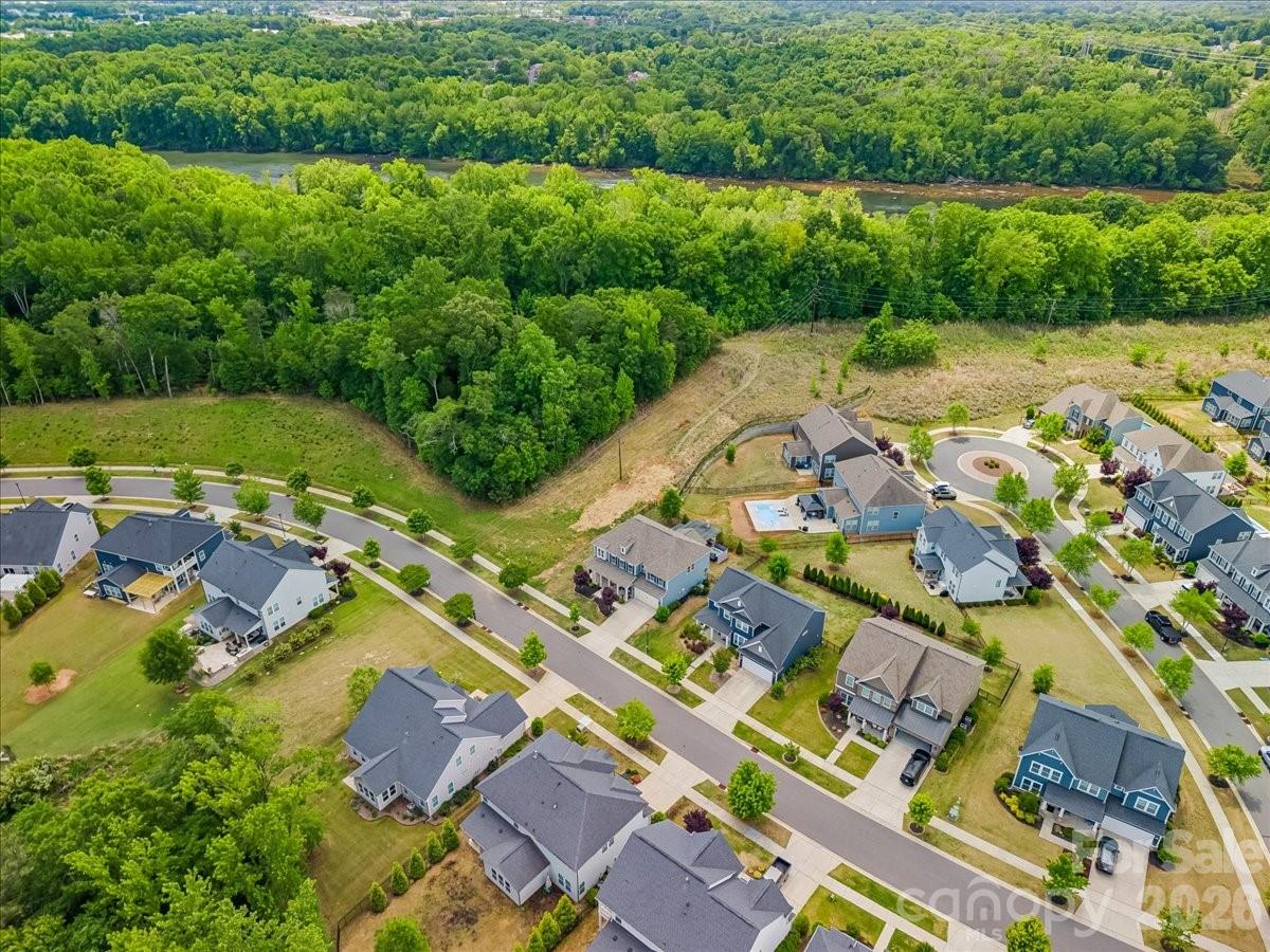 1135 Weir Court Fort Mill, SC 29708 - Photo 41 of 44 an aerial view of residential houses with outdoor space and swimming pool