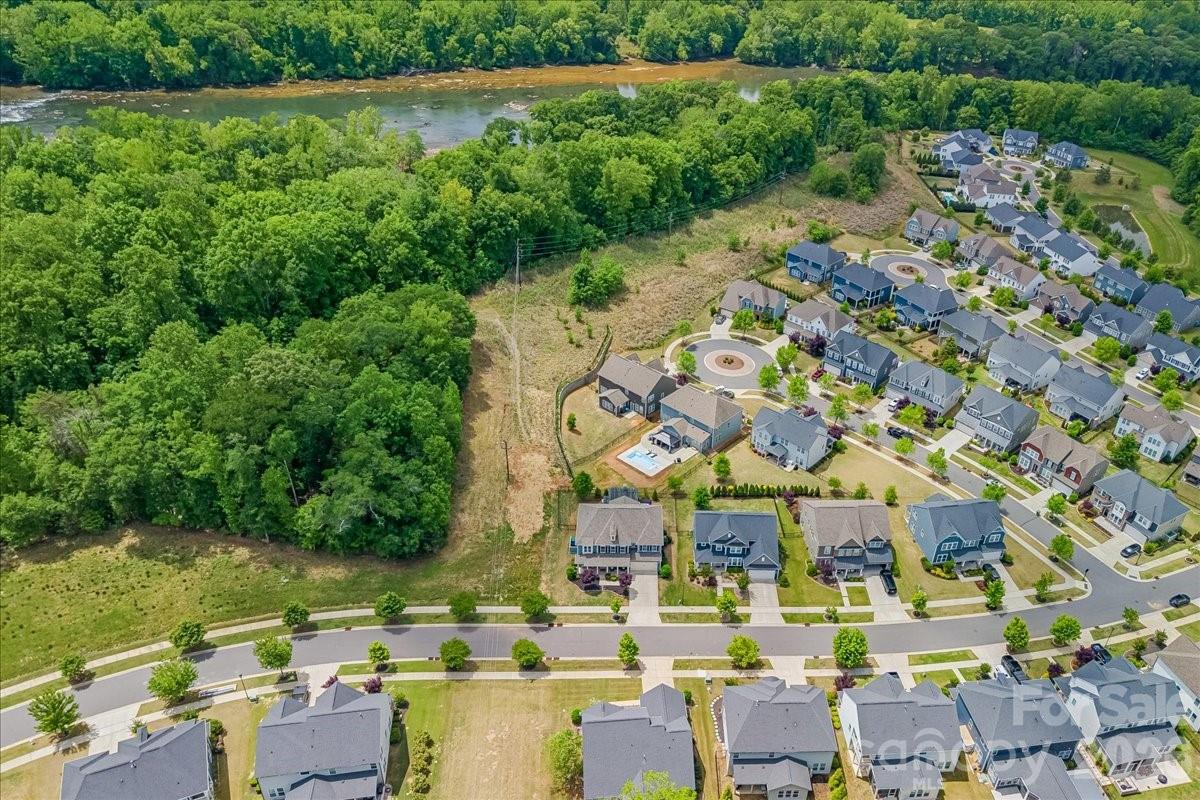 1135 Weir Court Fort Mill, SC 29708 - Photo 7 of 44 an aerial view of residential houses with outdoor space and swimming pool