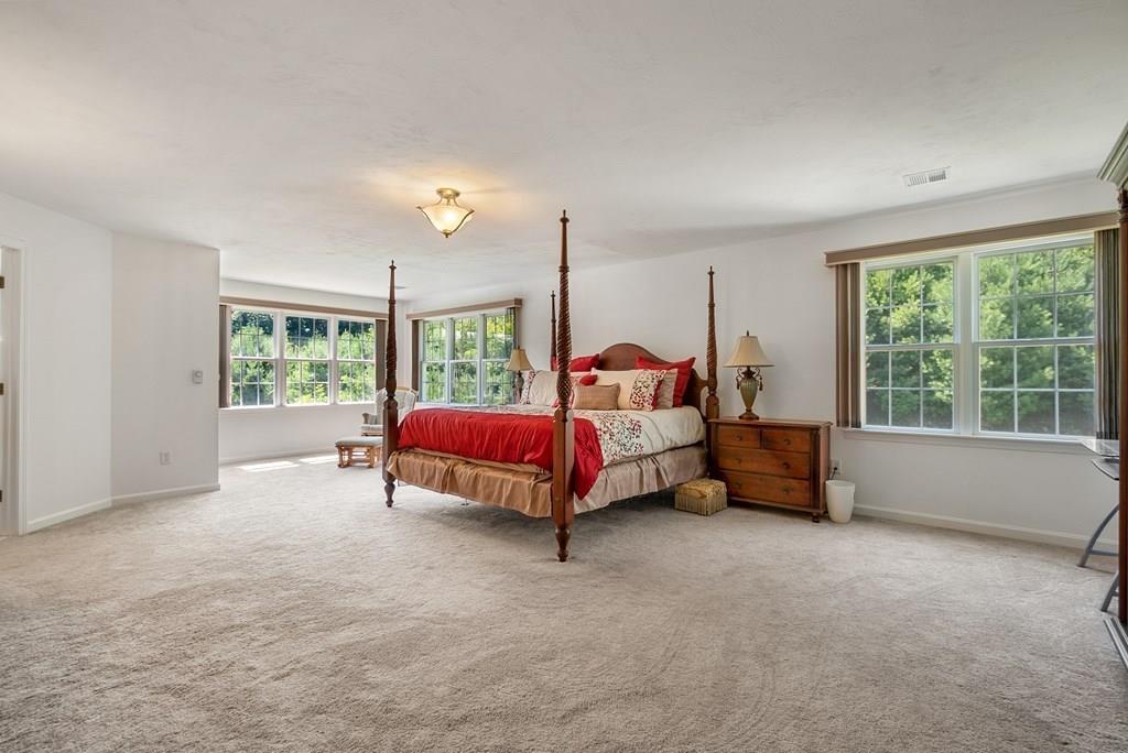 300 Crownshield Avenue Uxbridge, MA 01569 - Photo 13 of 29 a bed room with furniture and a window