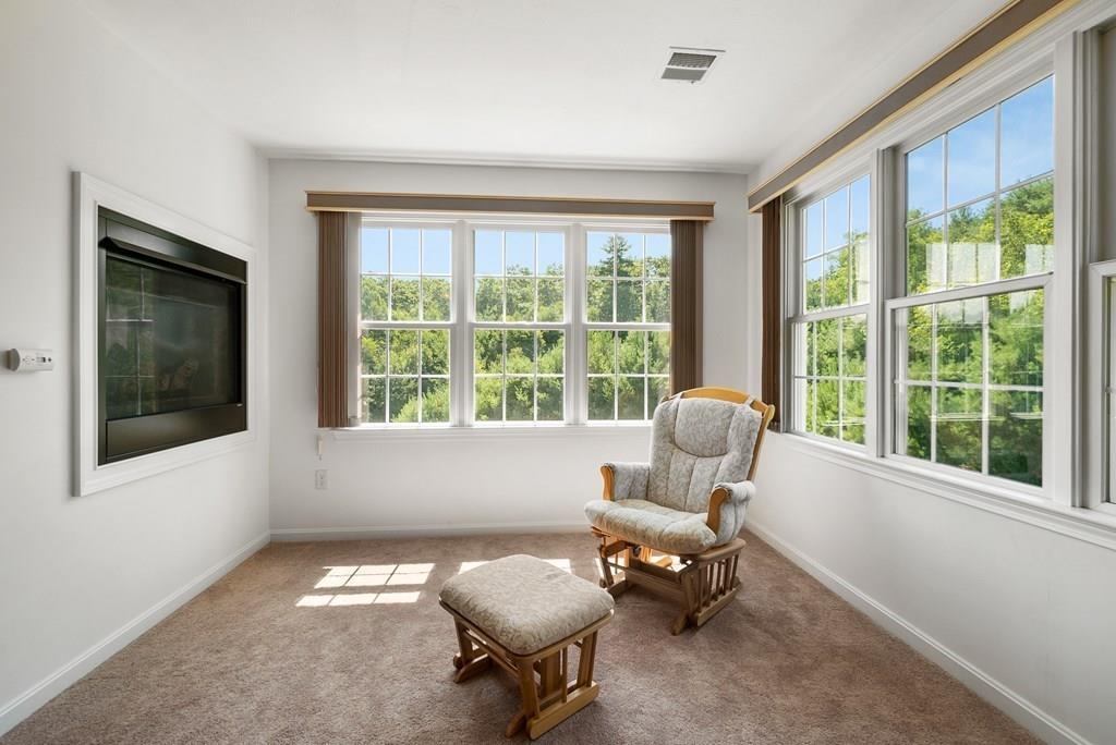 300 Crownshield Avenue Uxbridge, MA 01569 - Photo 14 of 29 a living room with furniture and a large window