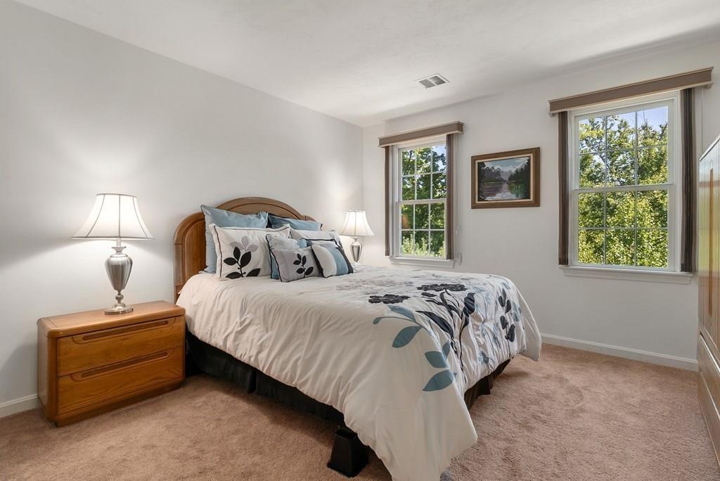 300 Crownshield Avenue Uxbridge, MA 01569 - Photo 19 of 29 a bedroom with a bed and window