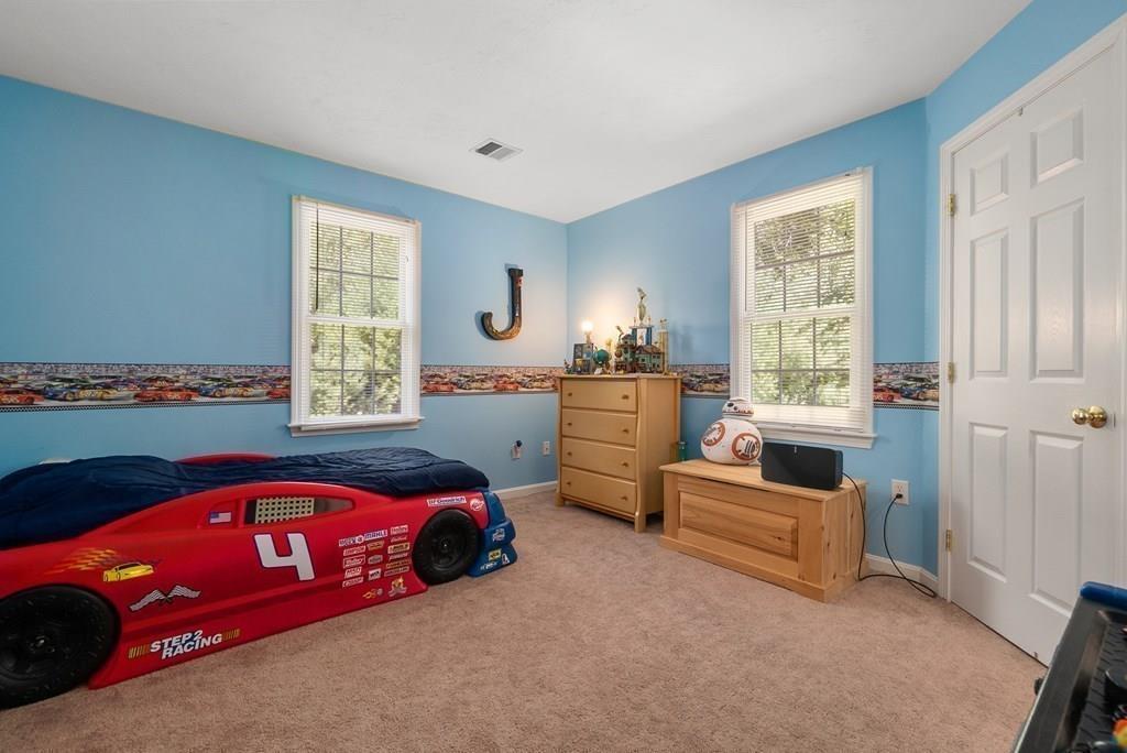 300 Crownshield Avenue Uxbridge, MA 01569 - Photo 23 of 29 a bedroom with bed and window