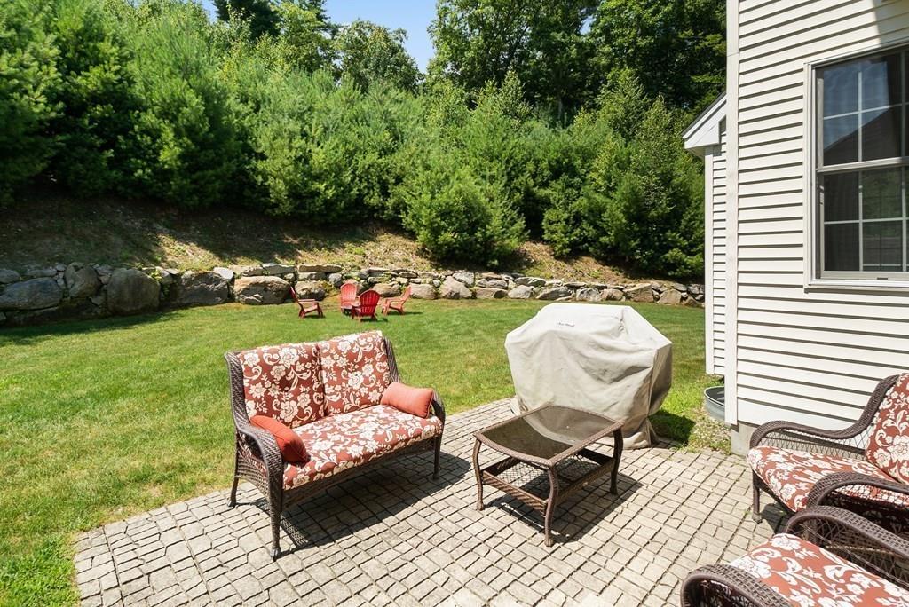 300 Crownshield Avenue Uxbridge, MA 01569 - Photo 26 of 29 a view of a backyard with sitting area