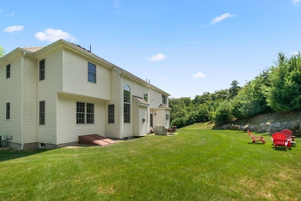 300 Crownshield Avenue Uxbridge, MA 01569 - Photo 27 of 29 a view of a house with a backyard