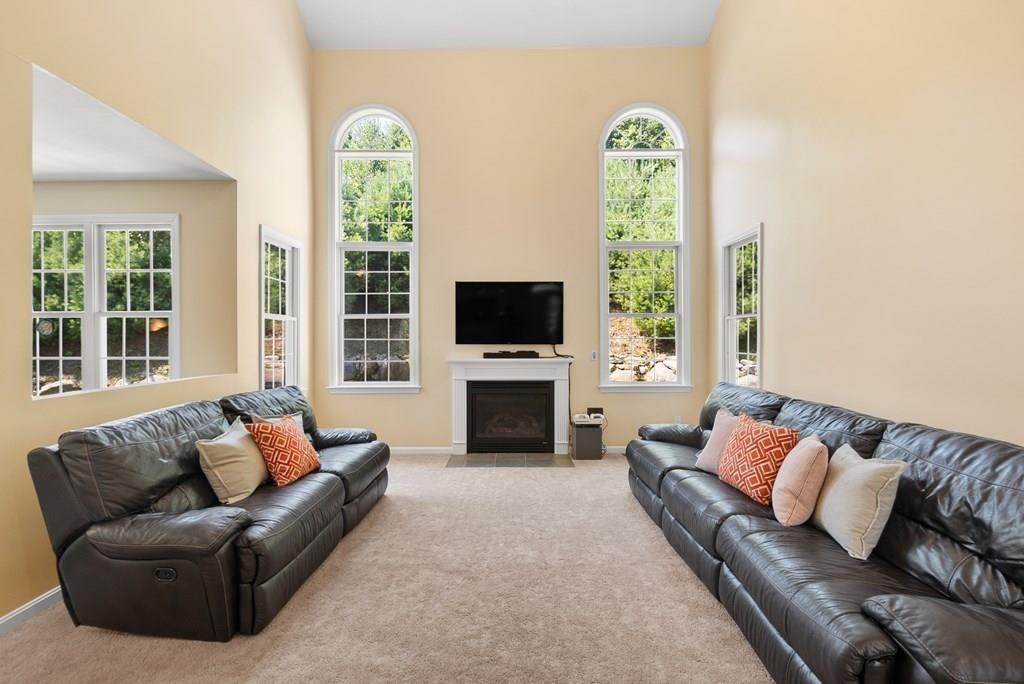300 Crownshield Avenue Uxbridge, MA 01569 - Photo 3 of 29 a living room with furniture fireplace and window