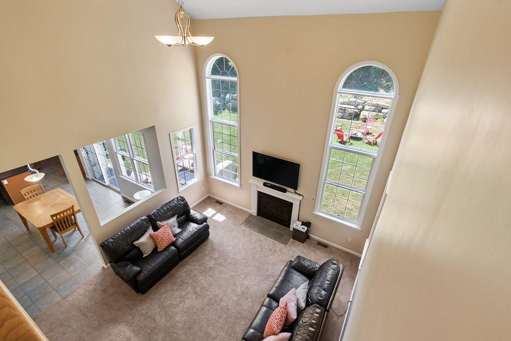 300 Crownshield Avenue Uxbridge, MA 01569 - Photo 5 of 29 a living room with furniture and a flat screen tv