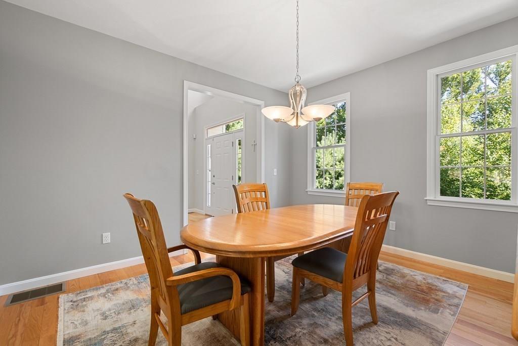 300 Crownshield Avenue Uxbridge, MA 01569 - Photo 10 of 29 a view of a dining room with furniture window and wooden floor