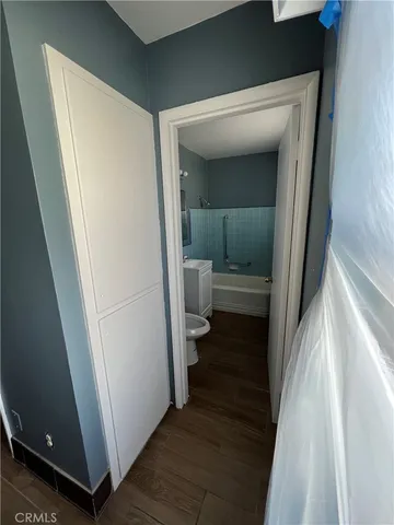 a view of a bathroom from a hallway