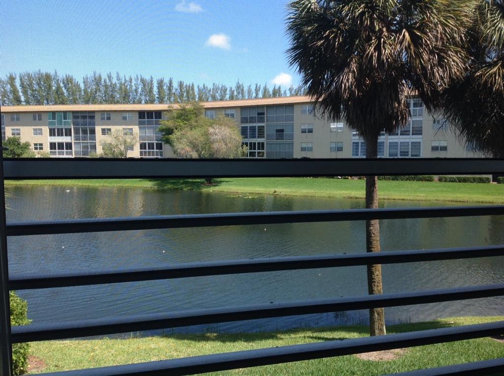 1805 Eleuthera Point, Unit J2 Coconut Creek, FL 33066 - Photo 14 of 22 a view of swimming pool from a balcony