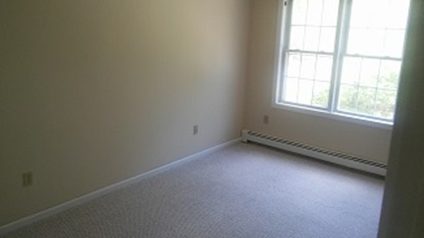 8 Mayflower Lane Rochester, MA 02770 - Photo 11 of 19 an empty room with a window