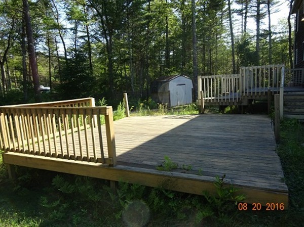 8 Mayflower Lane Rochester, MA 02770 - Photo 15 of 19 a view of backyard and deck