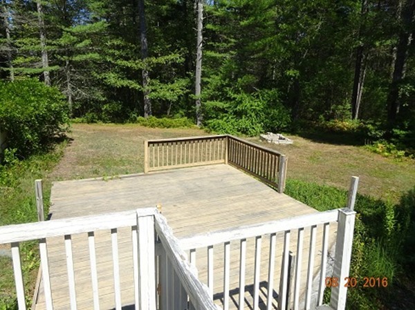 8 Mayflower Lane Rochester, MA 02770 - Photo 16 of 19 a view of backyard with deck and trees