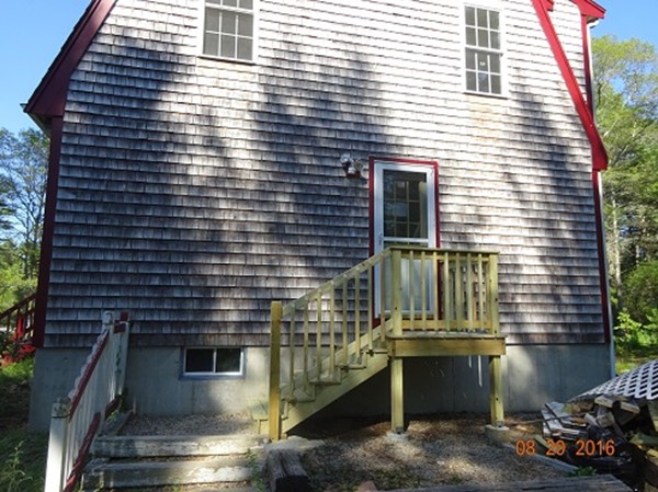 8 Mayflower Lane Rochester, MA 02770 - Photo 18 of 19 a view of a building with a window and large tree