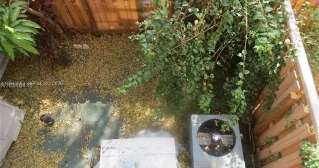 a view of a tree in front of a house