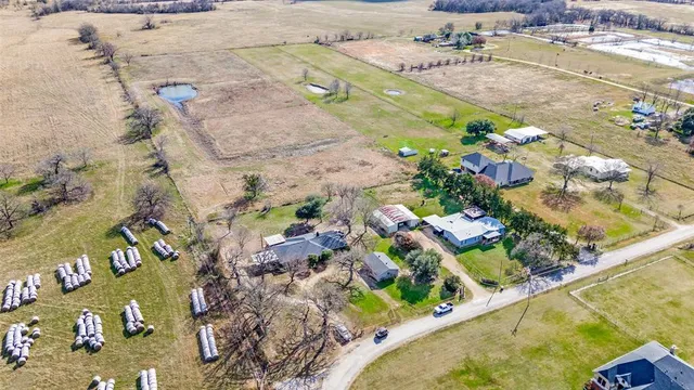 a view of large yard with large trees