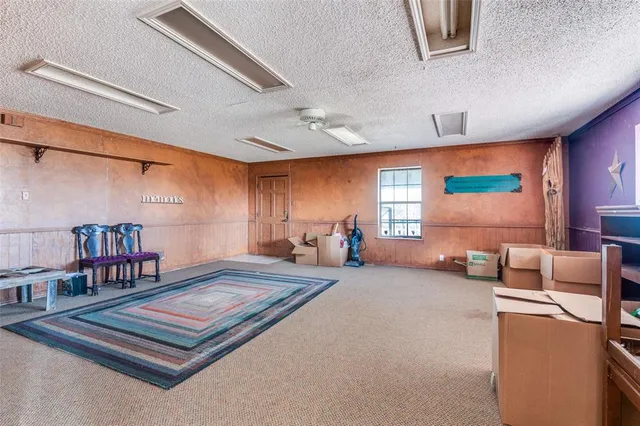 a bedroom with furniture and a book shelf