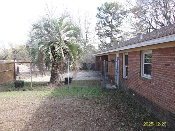 a backyard of a house with lots of green space