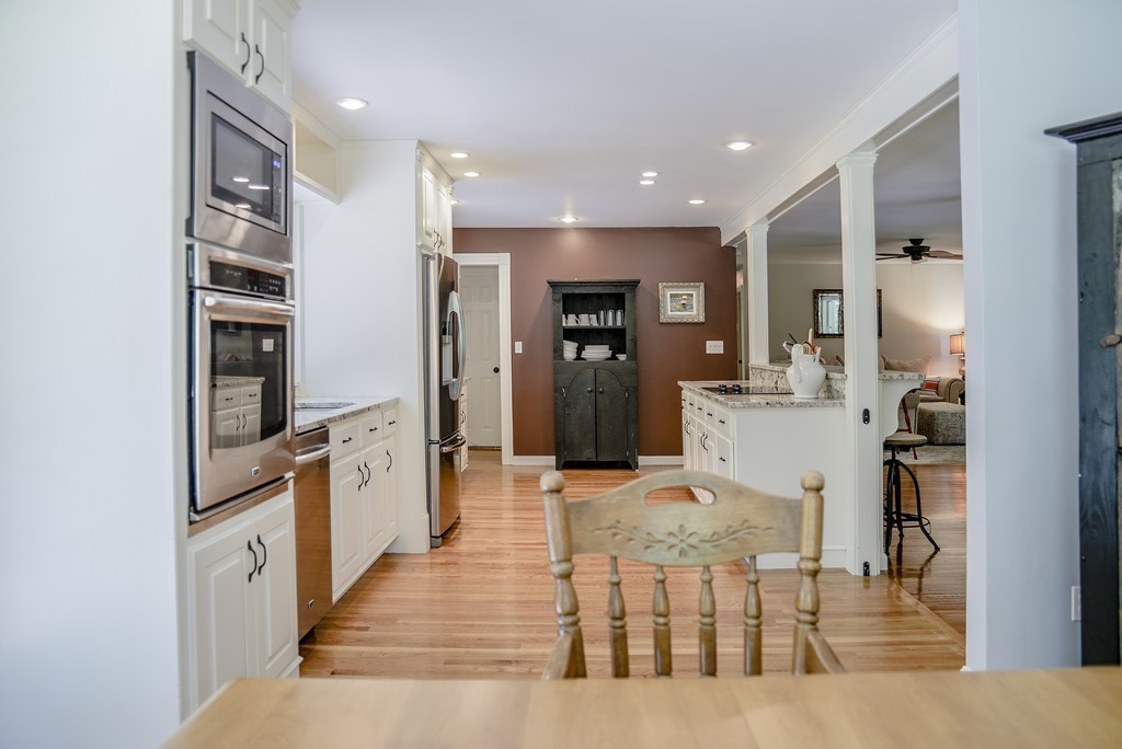 341 Main Street Boxford, MA 01921 - Photo 11 of 30 a large kitchen with a table and chairs