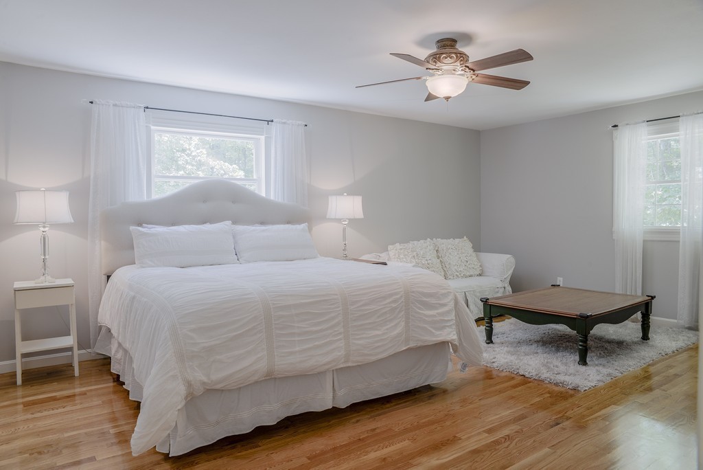341 Main Street Boxford, MA 01921 - Photo 16 of 30 a bedroom with a bed and a table in it