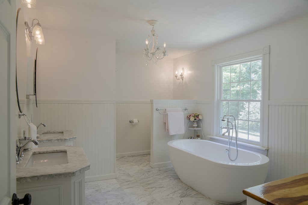 341 Main Street Boxford, MA 01921 - Photo 18 of 30 a spacious bathroom with a bathtub sink and mirror