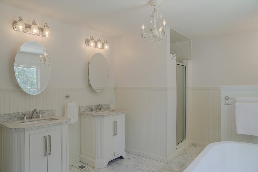 341 Main Street Boxford, MA 01921 - Photo 19 of 30 a bathroom with a double vanity sink and a mirror