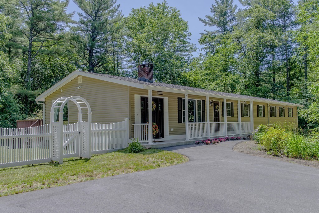 341 Main Street Boxford, MA 01921 - Photo 23 of 30 a front view of a house with a garden and trees