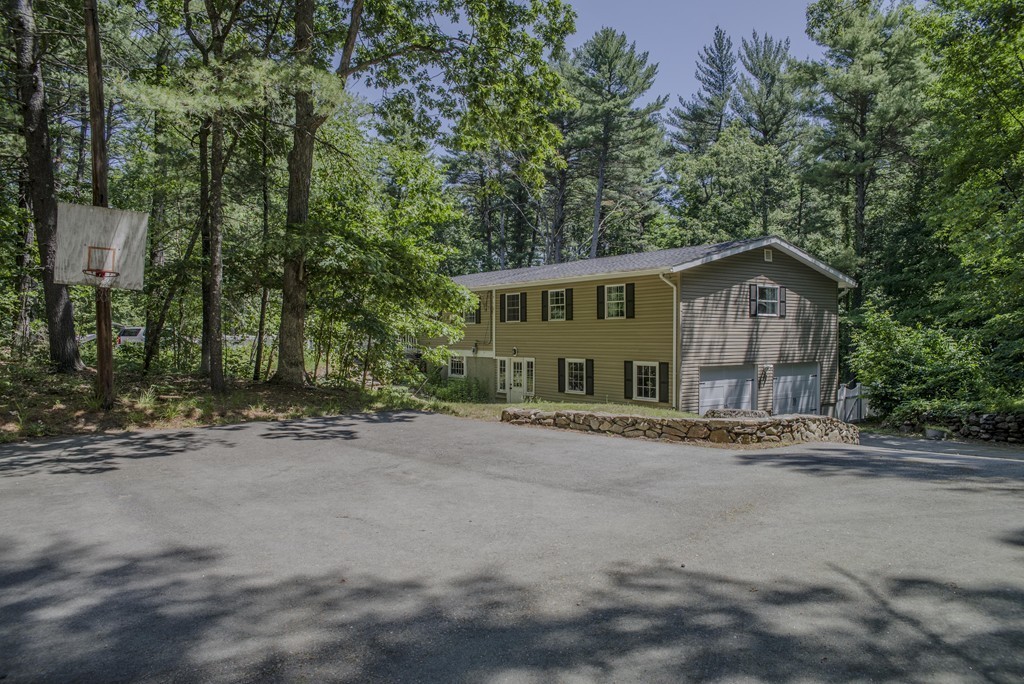 341 Main Street Boxford, MA 01921 - Photo 29 of 30 a front view of a house with a garden