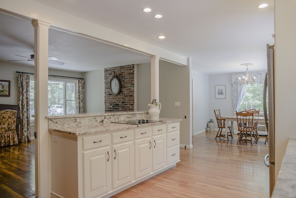 341 Main Street Boxford, MA 01921 - Photo 8 of 30 a spacious bathroom with a granite countertop double vanity and a large mirror