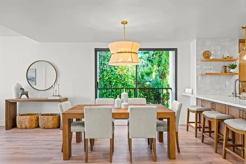 a view of a dining room with furniture window and outside view