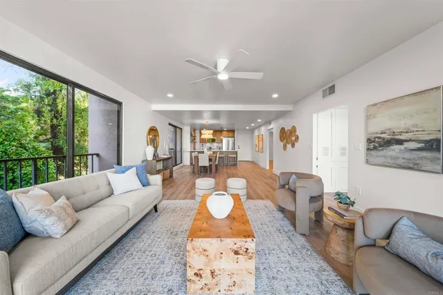 a living room with furniture and a large window