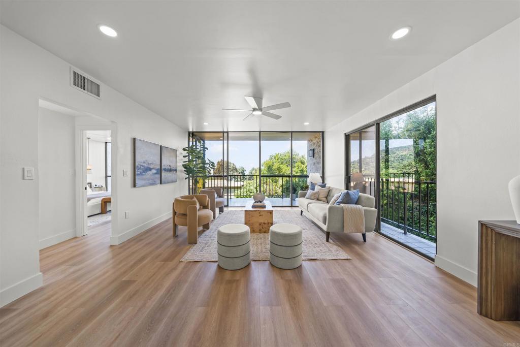 2500 Torrey Pines Road, Unit 305 La Jolla, CA 92037 - Photo 17 of 48 a living room with furniture and a large window