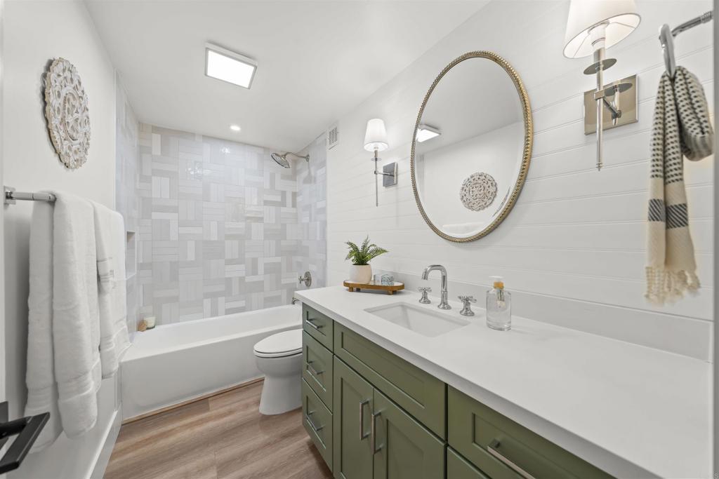 2500 Torrey Pines Road, Unit 305 La Jolla, CA 92037 - Photo 23 of 48 a bathroom with a sink a toilet and a mirror