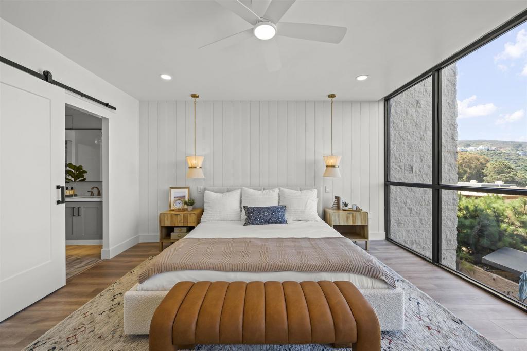 2500 Torrey Pines Road, Unit 305 La Jolla, CA 92037 - Photo 26 of 48 a bedroom with a large bed and a large window