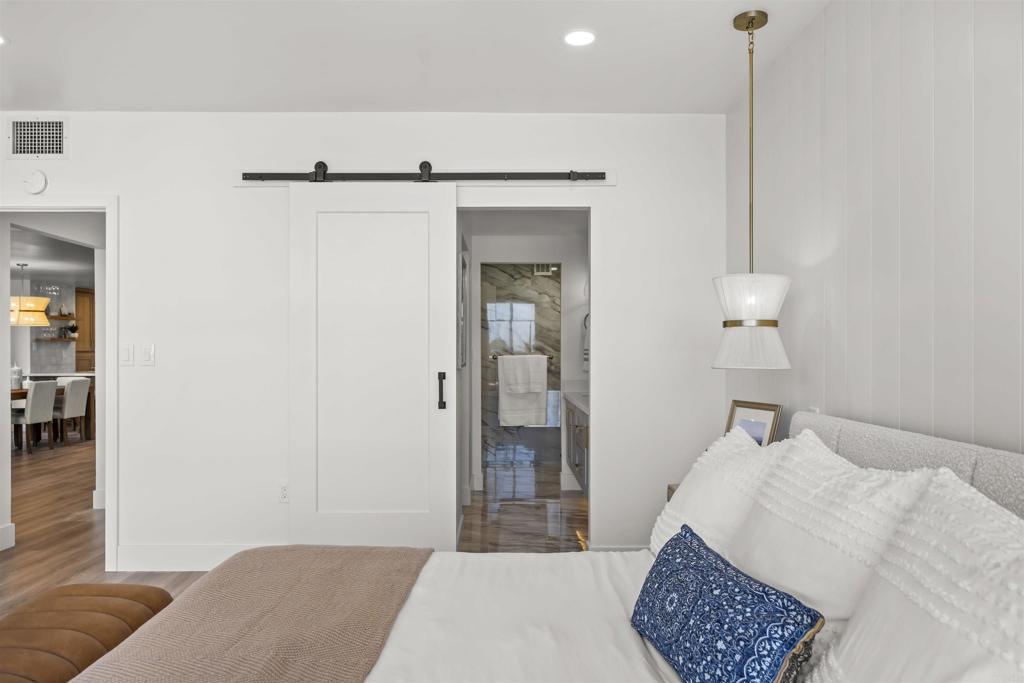 2500 Torrey Pines Road, Unit 305 La Jolla, CA 92037 - Photo 28 of 48 a bedroom with a bed and a dresser