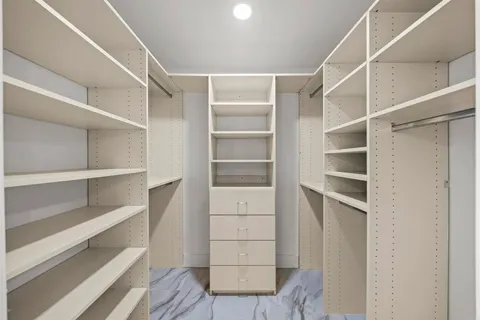 a spacious bathroom with a double vanity sink mirror and toilet