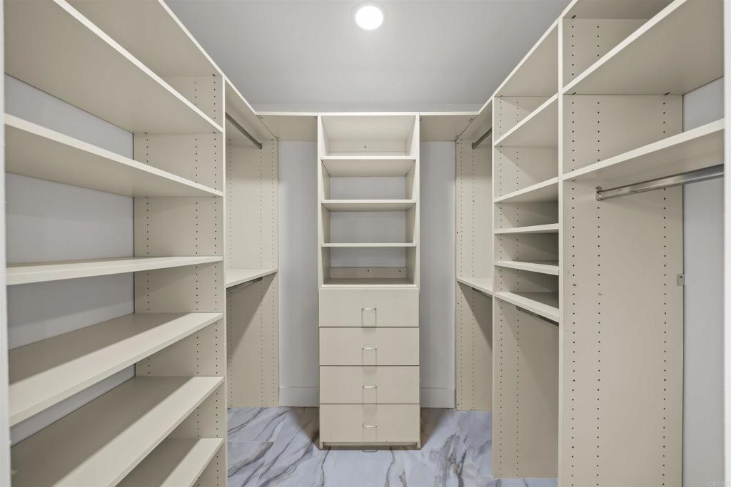 2500 Torrey Pines Road, Unit 305 La Jolla, CA 92037 - Photo 30 of 48 a view of walk in closet with empty racks