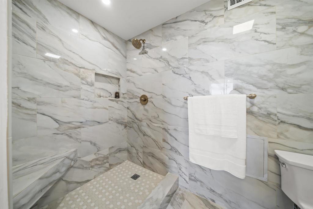 2500 Torrey Pines Road, Unit 305 La Jolla, CA 92037 - Photo 32 of 48 a bathroom with a bathtub and shower