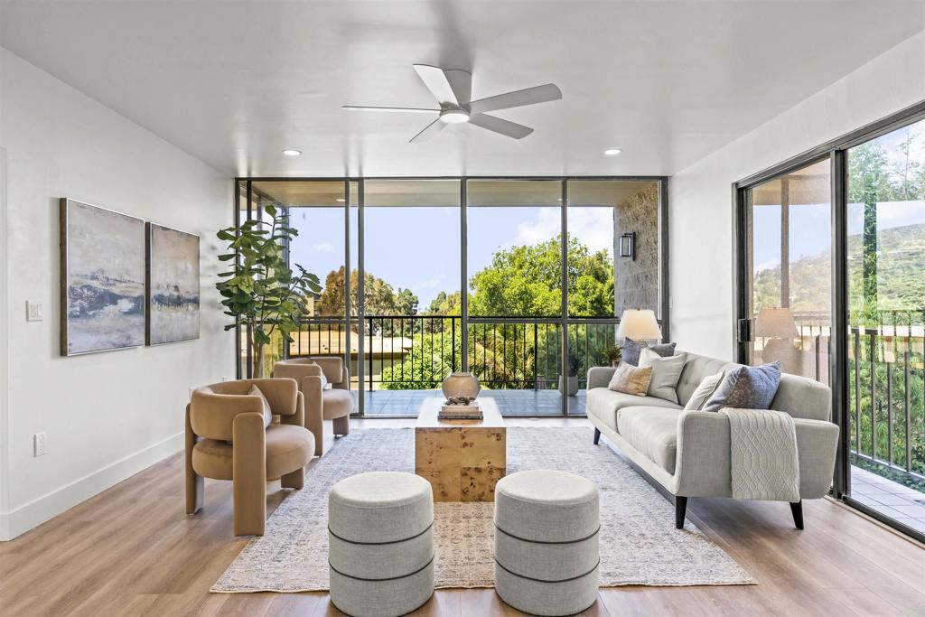 2500 Torrey Pines Road, Unit 305 La Jolla, CA 92037 - Photo 4 of 48 a living room with patio furniture and a floor to ceiling window