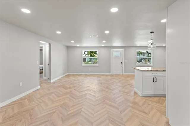 a view of a kitchen with windows