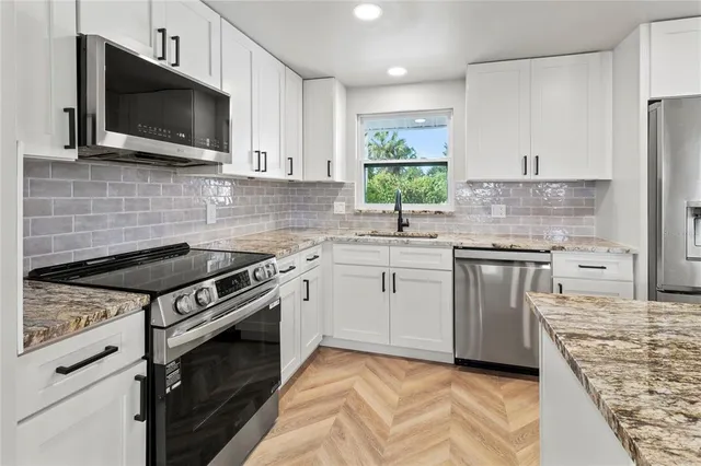 a kitchen with a stove and a microwave