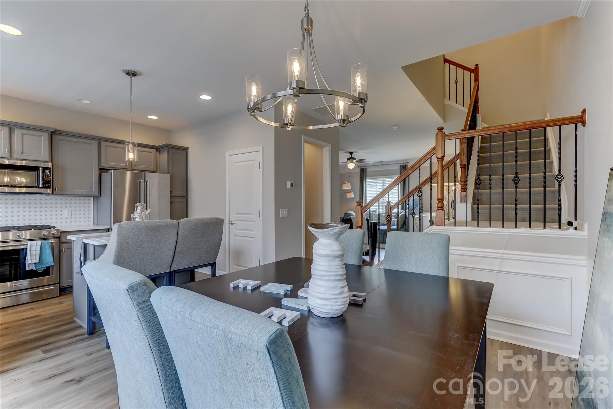 905 Lyndley Drive Fort Mill, SC 29708 - Photo 13 of 42 a dining room with furniture a chandelier and wooden floor