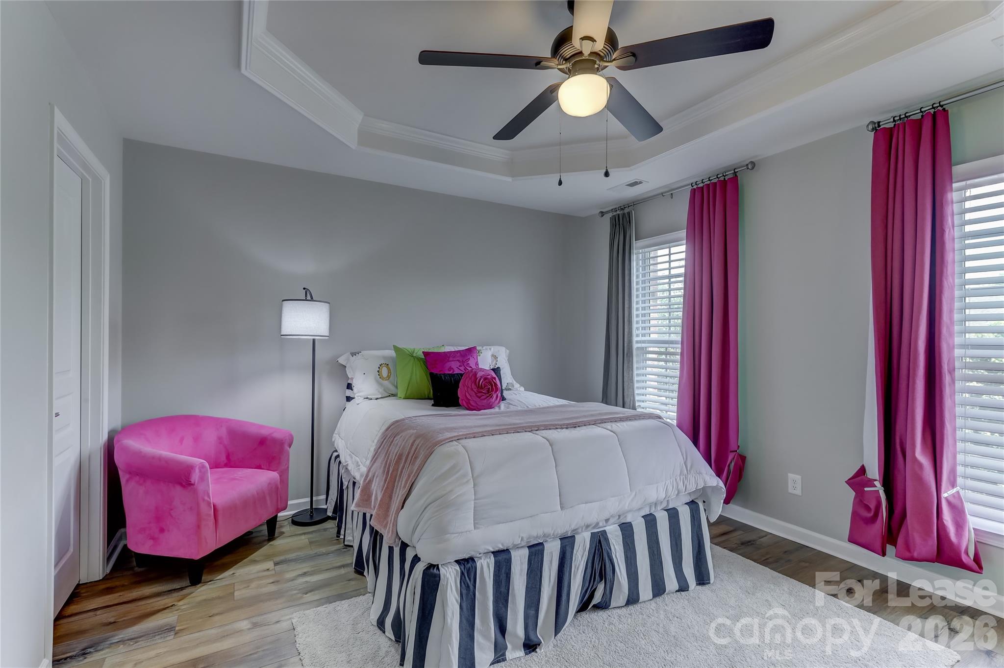 905 Lyndley Drive Fort Mill, SC 29708 - Photo 26 of 42 a bedroom with a bed and a chandelier