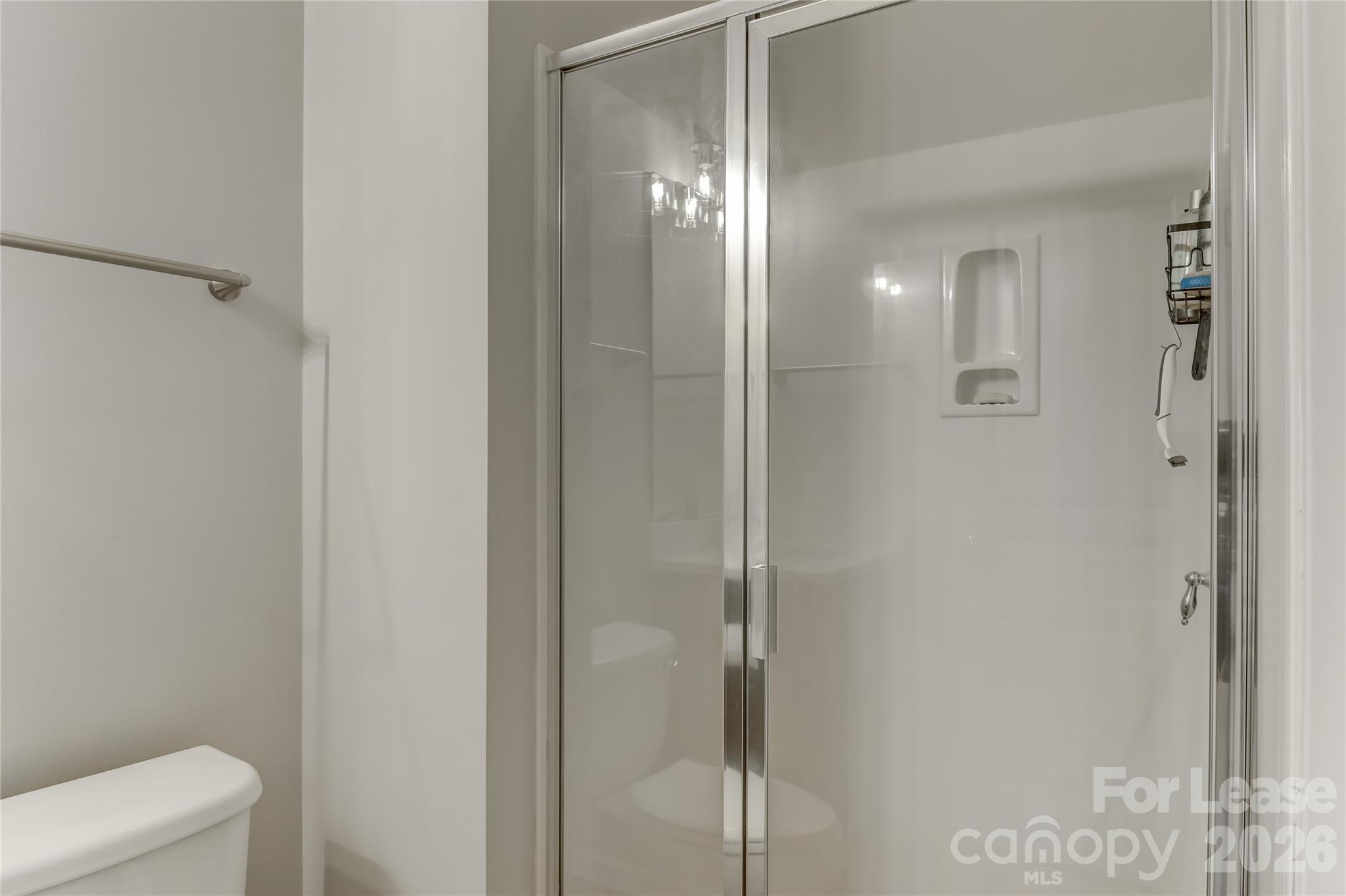 905 Lyndley Drive Fort Mill, SC 29708 - Photo 39 of 42 a bathroom with a glass shower door