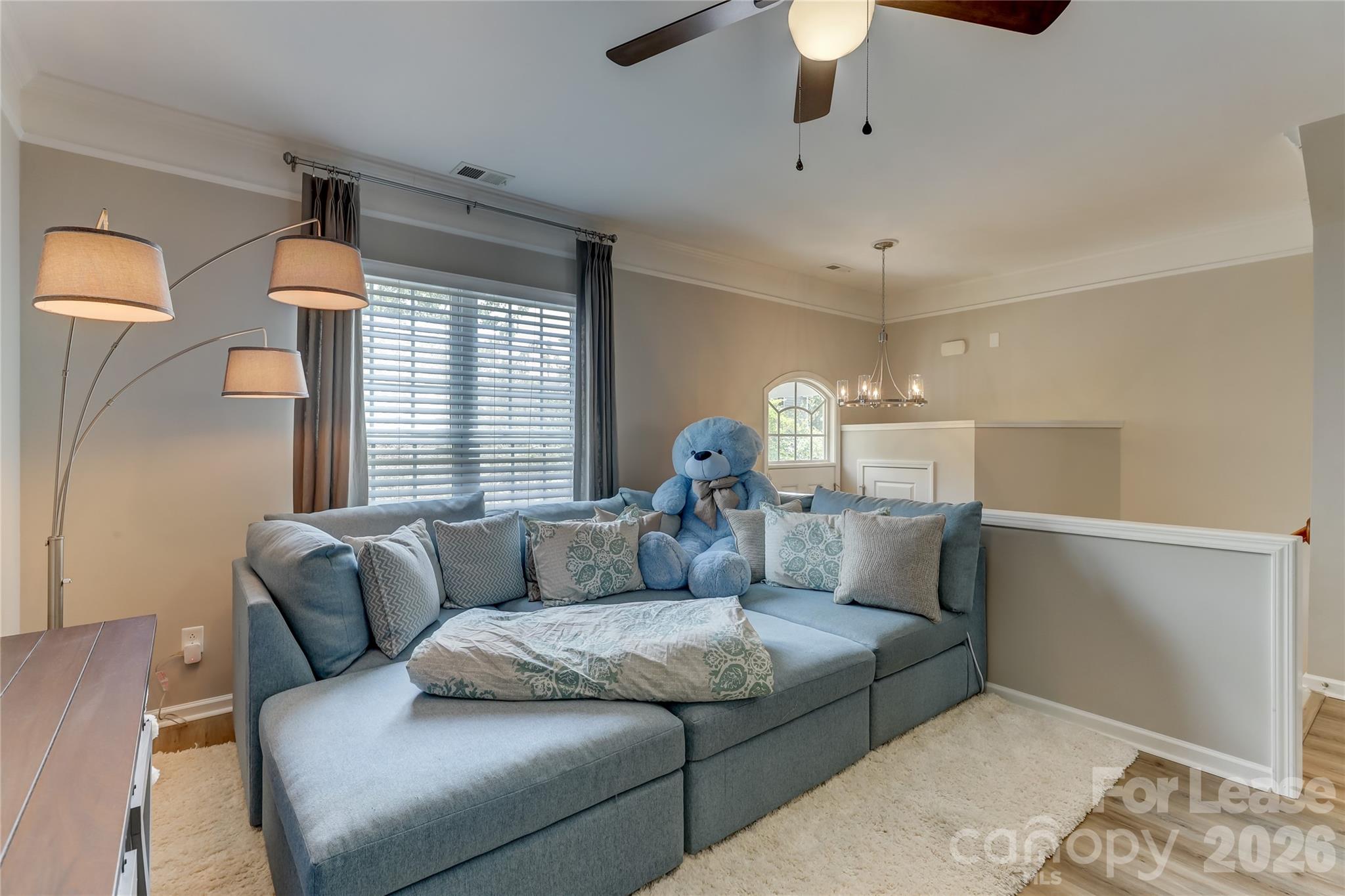 905 Lyndley Drive Fort Mill, SC 29708 - Photo 8 of 42 a living room with furniture and a chandelier