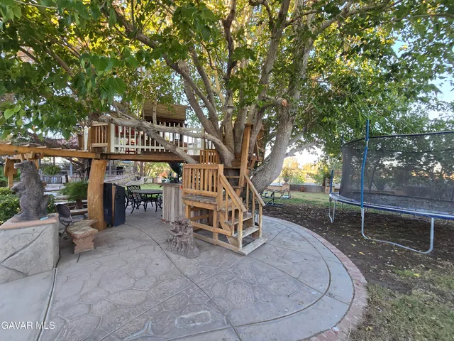 a bathroom with a shower curtain and toilet