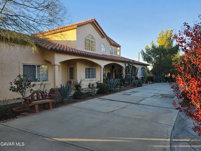a white toilet sitting next to a shower curtain