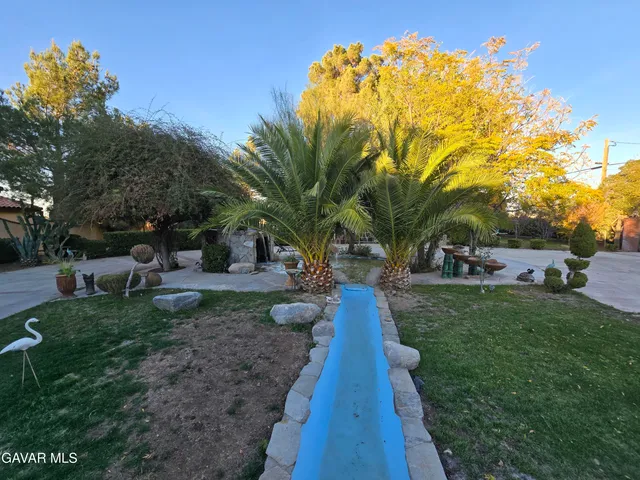 an aerial view of beach and residential houses with outdoor space